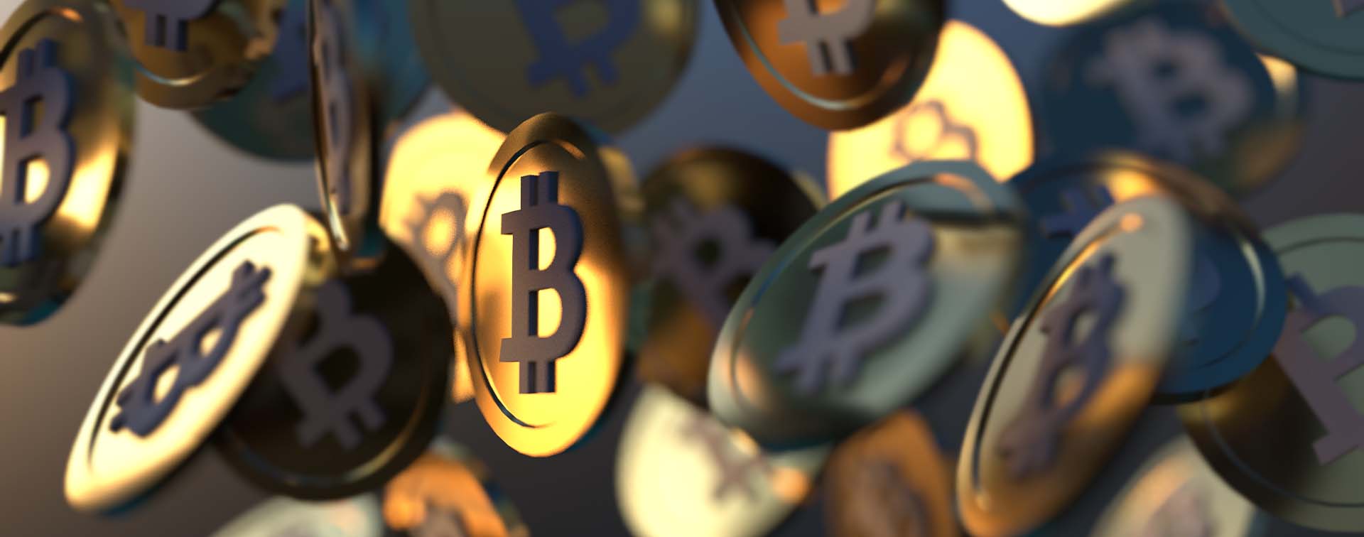 Gold coins with the bitcoin logo