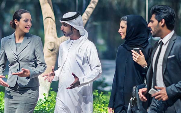 Middle Eastern businesspeople in discussion